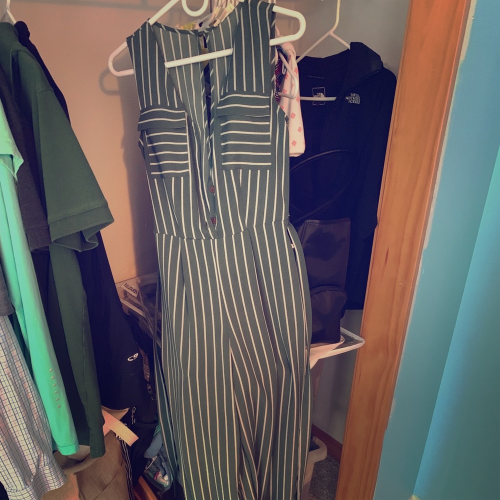 Long green jumpsuit with white stripes and belt